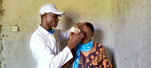 Clinician performing an eye examination