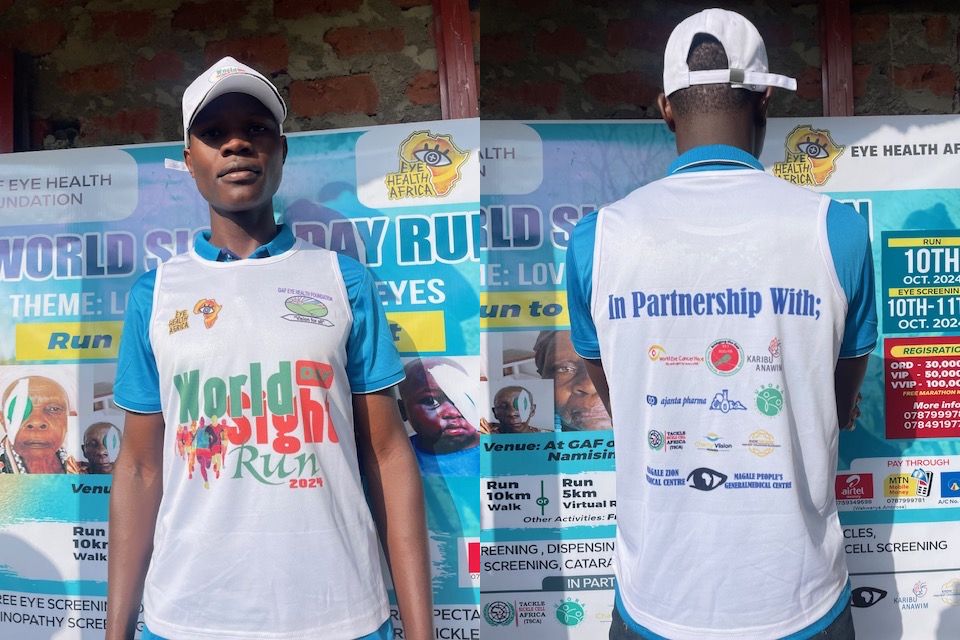 Mini-marathon runner wearing T-shirt displaying partner logos