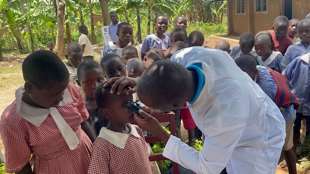 A child undergoing an eye examination during a school screening