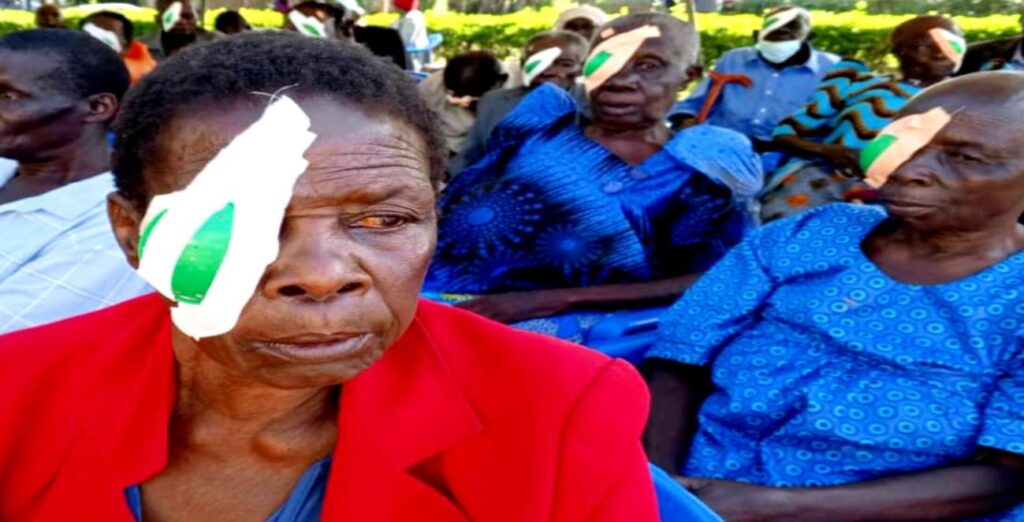 One patient, with an eye covered, after receiving cataract surgery to restore sight